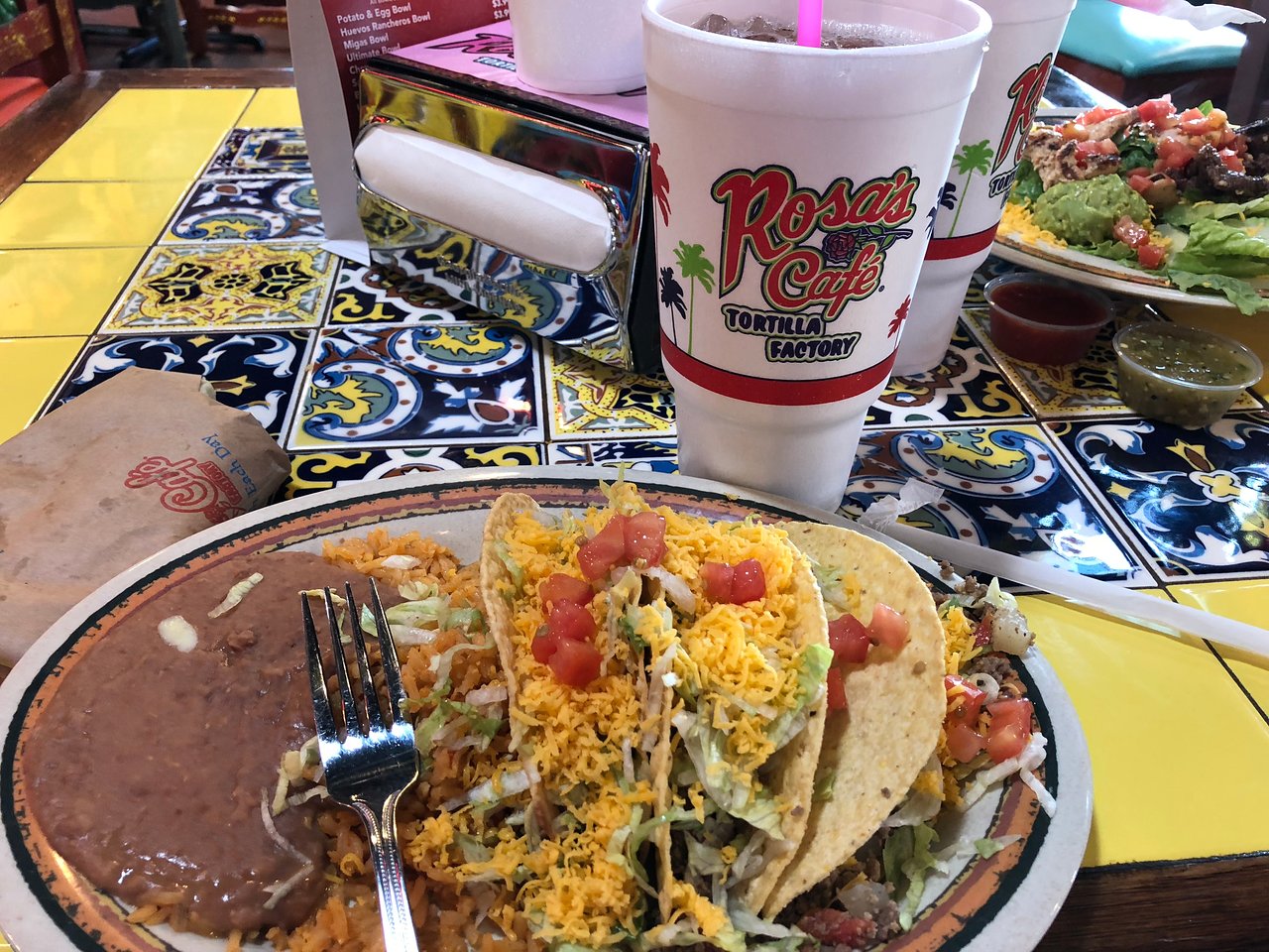 Rosa's Cafe signature dishes Chicken Enchilada PlateTaco PlateSmothered Burrito Dinner